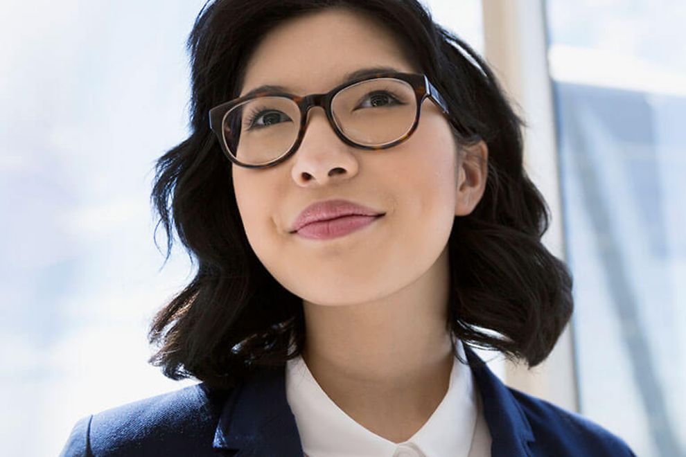 Young business woman wearing glasses.